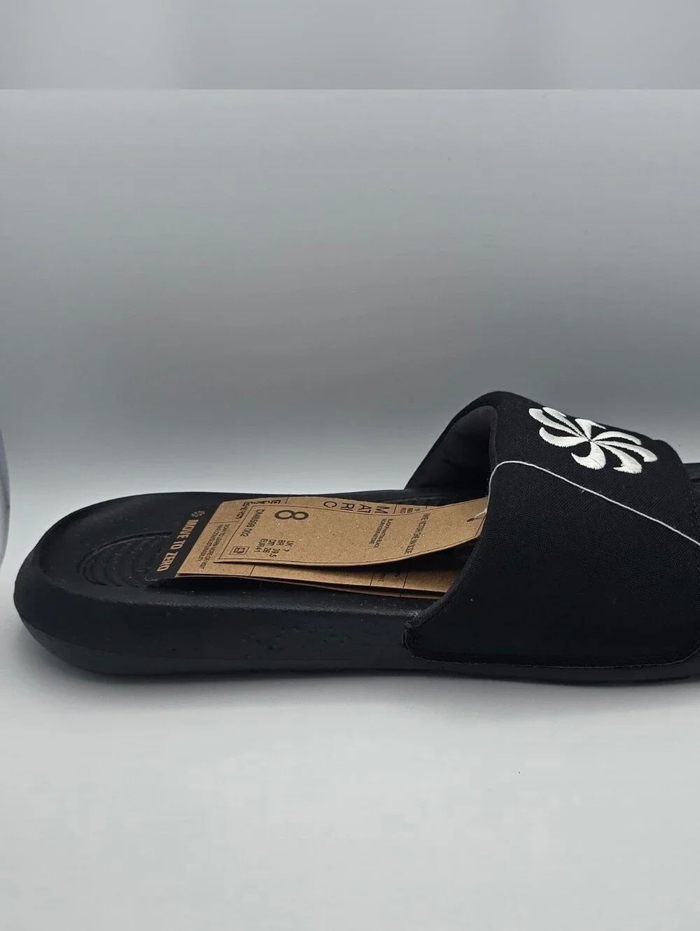 Nike Victori One Black Slide Sandals with White Floral Logo